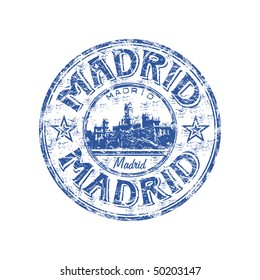 Blue grunge rubber stamp with the name of Madrid the capital of Spain written inside the stamp