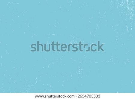 Blue grunge scratched texture background. Rough distressed vintage backdrop. Abstract pastel damaged surface with faded design.
