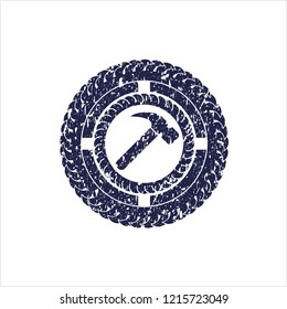 Blue hammer icon inside distressed rubber grunge stamp
