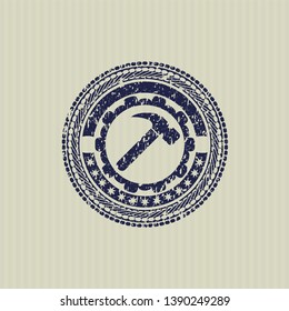Blue hammer icon inside distressed grunge seal