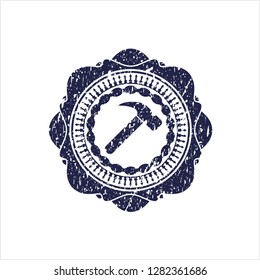 Blue hammer icon inside grunge style stamp