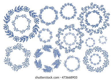 Blue hand drawn wreaths. Decoration frames. Hand drawn borders. Vector illustration.