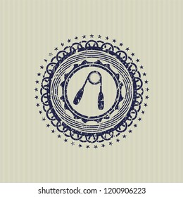 Blue hand gripper icon inside distress rubber stamp with grunge texture
