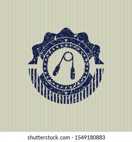 Blue hand gripper icon inside distressed rubber stamp
