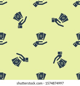 Blue Hand holding deck of playing cards icon isolated seamless pattern on yellow background. Casino gambling.  Vector Illustration
