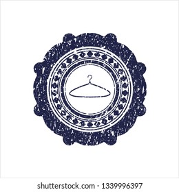 Blue hanger icon inside distressed rubber grunge texture seal