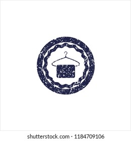 Blue hanger with towel icon inside distress grunge seal