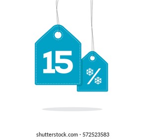 Blue hanging price tag labels with 15% text and snowflake percent design on them and with shadow isolated on white background. For winter sale campaigns. 