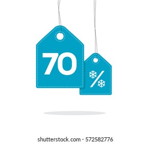 Blue hanging price tag labels with 70% text and snowflake percent design on them and with shadow isolated on white background. For winter sale campaigns. 