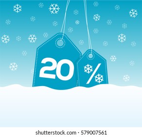 Blue hanging price tag labels with 20% and snowflake percent design texts on them on snow background. For winter sale campaigns.