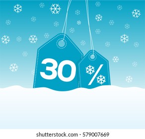 Blue hanging price tag labels with 30% and snowflake percent design texts on them on snow background. For winter sale campaigns.