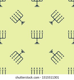 Blue Hanukkah menorah icon isolated seamless pattern on yellow background. Hanukkah traditional symbol. Holiday religion, jewish festival of Lights.  Vector Illustration