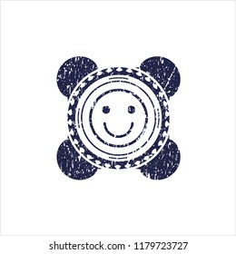 Blue happy face icon inside distressed rubber seal