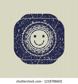 Blue happy face icon inside distressed grunge style stamp