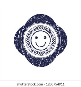 Blue happy face icon inside rubber stamp