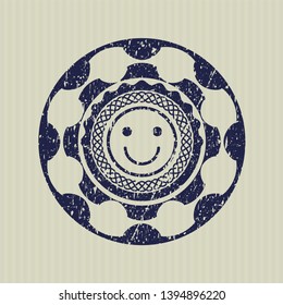 Blue happy face icon inside distress rubber stamp