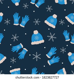 Sombrero azul y guantes con piel clara y copos de nieve sobre fondo azul oscuro-gris. Decoración de ropa de doodle de invierno, muy acogedora. Adecuado para textiles, envasado.