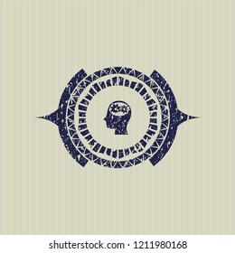 Blue head with gears inside icon inside distressed rubber texture