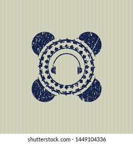Blue headphones icon inside distressed grunge seal
