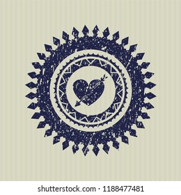 Blue heart with arrow icon inside distressed rubber grunge texture seal