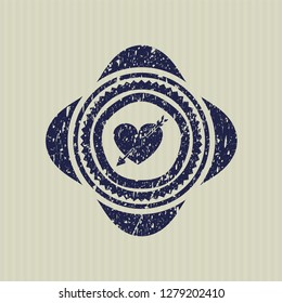  Blue heart with arrow icon inside distress rubber stamp with grunge texture