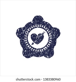 Blue heart with arrow icon inside distress rubber stamp