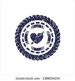 Blue heart with arrow icon inside distressed rubber texture