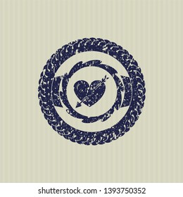 Blue heart with arrow icon with rubber seal texture
