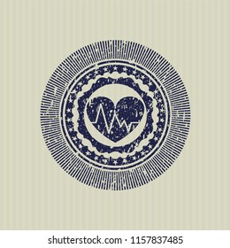 Blue heart with electrocardiogram icon inside distressed with rubber seal texture