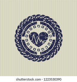 Blue heart with electrocardiogram icon inside distressed rubber texture