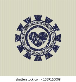 Blue heart with electrocardiogram icon inside distress rubber stamp with grunge texture