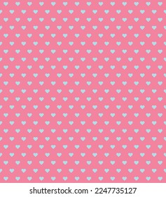 Blue heart shape on pink background. Happy Valentine's day. Heart pattern on pink backdrop.