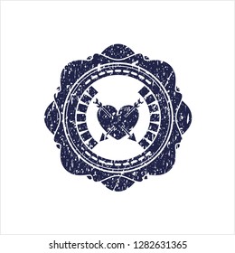 Blue heart with two arrows icon inside distress rubber stamp with grunge texture