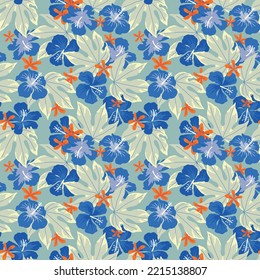 Blue hibiscus flowers on a blue green background. Busy tropical seamless vector pattern design for wallpaper, stationery and textile design.