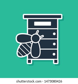 Blue Hive for bees icon isolated on green background. Beehive symbol. Apiary and beekeeping. Sweet natural food.  Vector Illustration