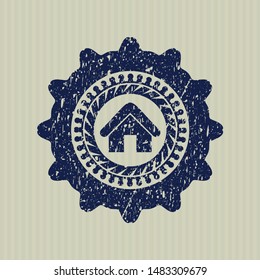 Blue home icon inside grunge stamp