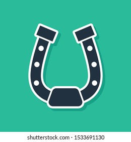 Blue Horseshoe icon isolated on green background.  Vector Illustration