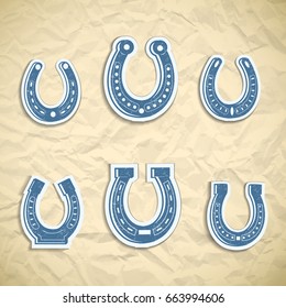 Blue horseshoe icon set different shapes and forms on paper background vector illustration