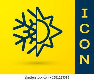 Blue Hot and cold symbol. Sun and snowflake icon isolated on yellow background. Winter and summer symbol.  Vector Illustration