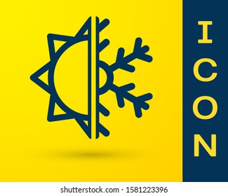 Blue Hot and cold symbol. Sun and snowflake icon isolated on yellow background. Winter and summer symbol.  Vector Illustration