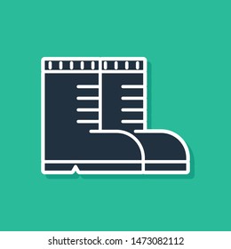 Blue Hunter boots icon isolated on green background.  Vector Illustration