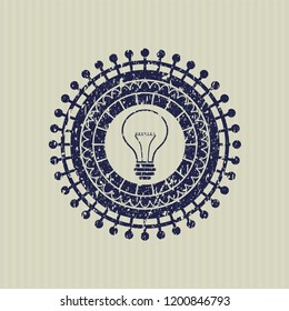 Blue idea icon inside distress rubber stamp