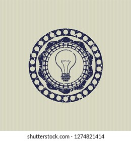 Blue idea icon inside distress rubber grunge seal