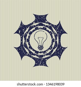 Blue idea icon inside distressed grunge style stamp