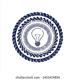 Blue idea icon inside distressed grunge stamp