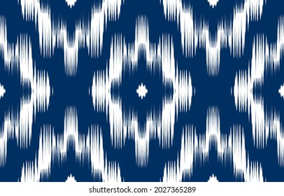 Blue Ikat ethnic zigzag design
 background. Seamless ikat floral pattern in tribal, folk embroidery abstract art. art ornament print.Design for carpet, wallpaper, clothing, wrapping, fabric, fashion