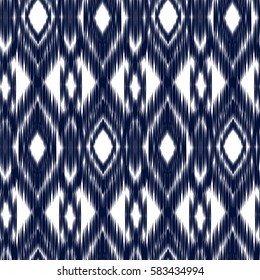 Blue Ikat Ogee Seamless Background Pattern. Abstract background for textile design, wallpaper, surface textures