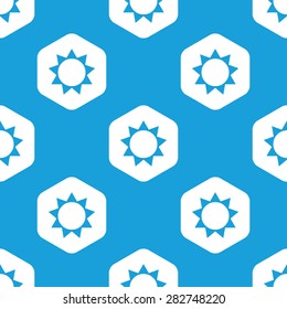 Blue image of sun in white hexagon, repeated on blue