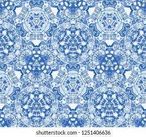 Blue kaleidoscope seamless pattern, background. Composed of abstract and geometric shapes. Useful as design element for texture and artistic compositions.