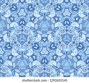 Blue kaleidoscope seamless pattern, background. Composed of abstract shapes. Useful as design element for texture and artistic compositions.